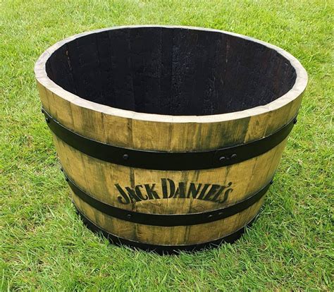 Genuine, used Jack Daniel whiskey barrel. . Jack daniels half barrel planter